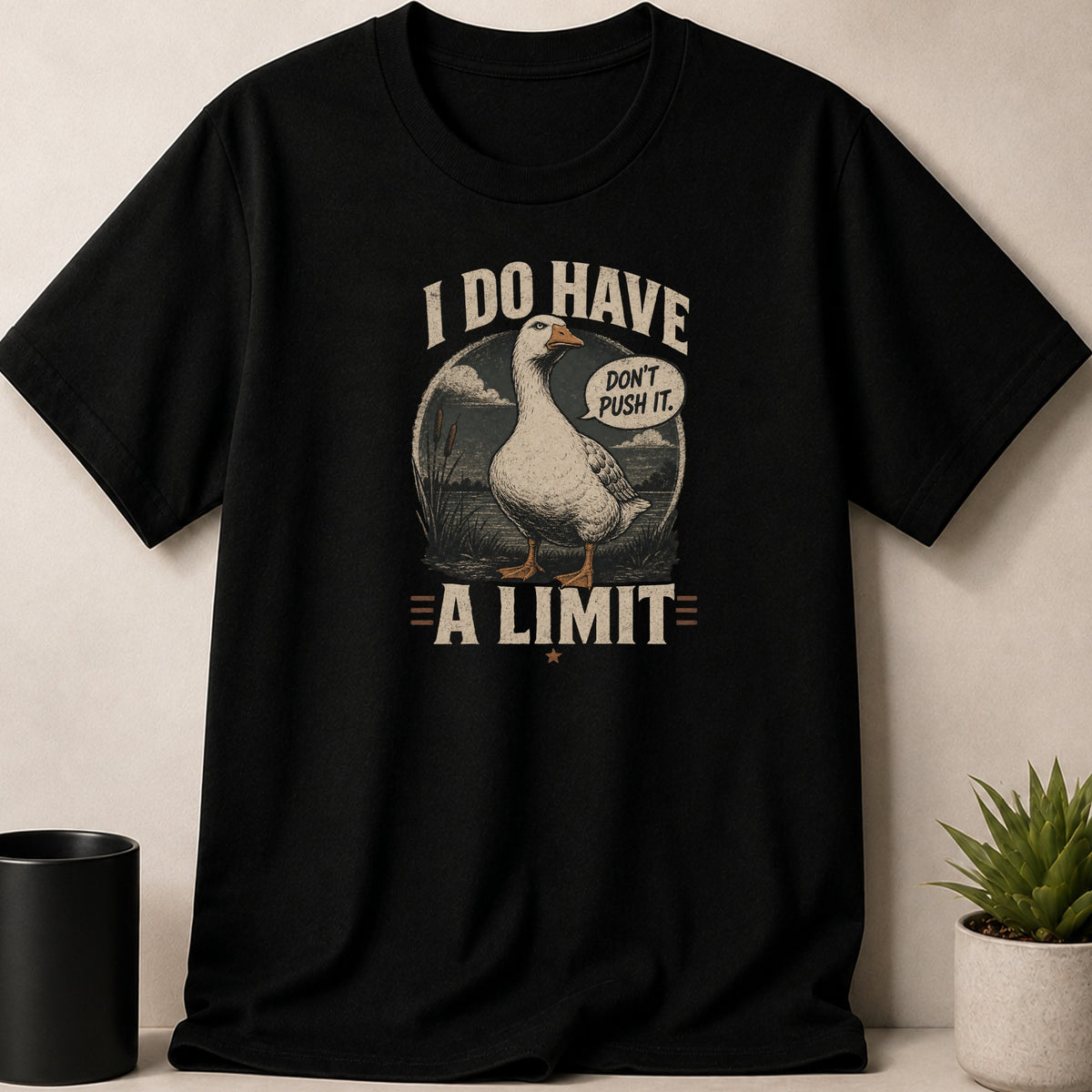 Black t-shirt with goose graphic saying "I DO HAVE A LIMIT. DON'T PUSH IT."