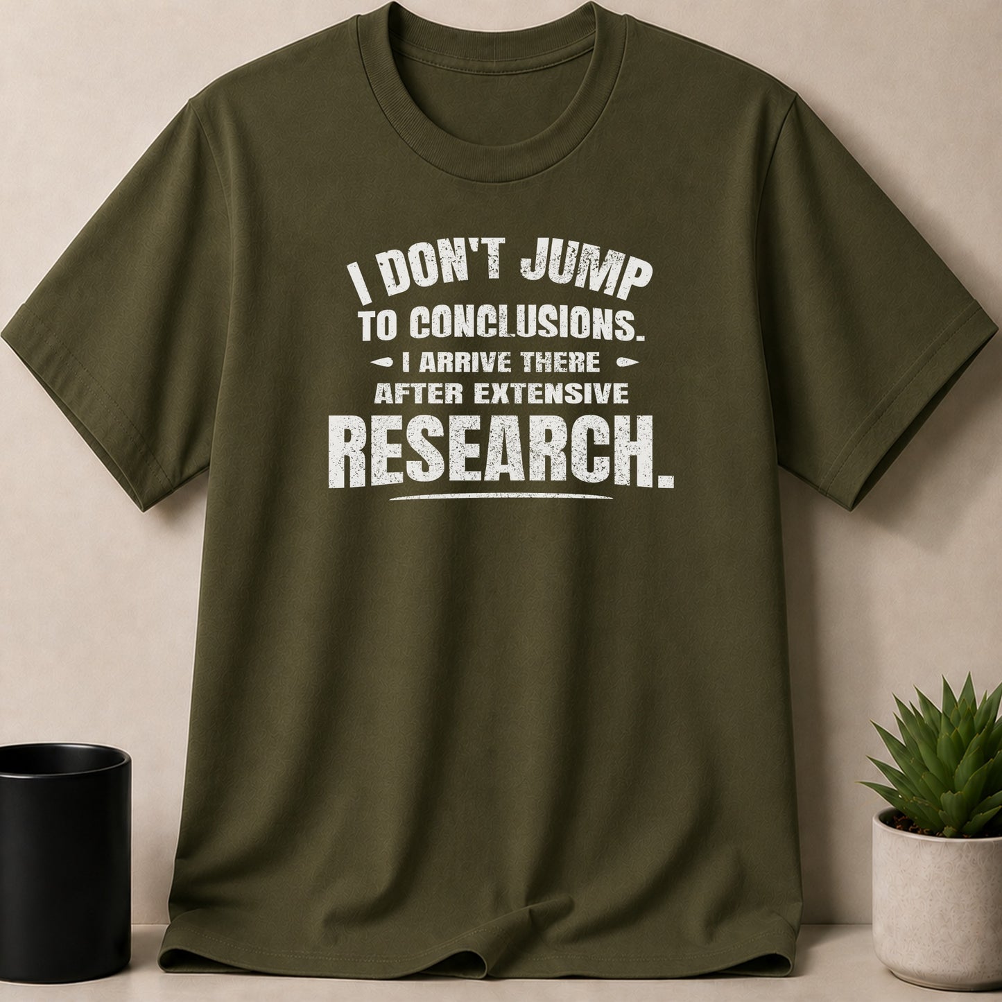 Green t-shirt with white text: "I don't jump to conclusions. I arrive there after extensive research."