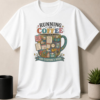 White t-shirt with "Running on Coffee" graphic, featuring a mug filled with daily tasks and items.