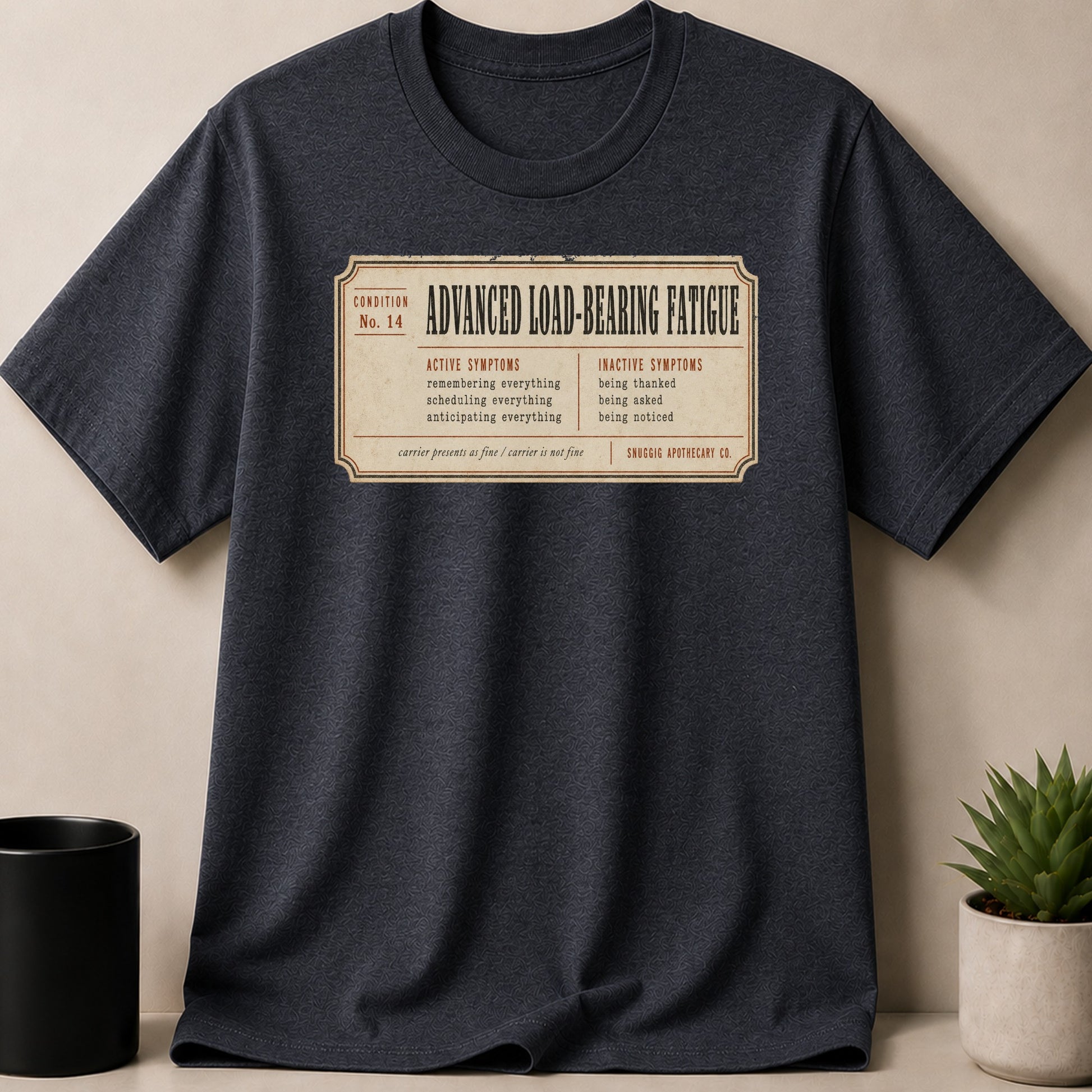 Dark gray t-shirt with "Advanced Load-Bearing Fatigue" label graphic.