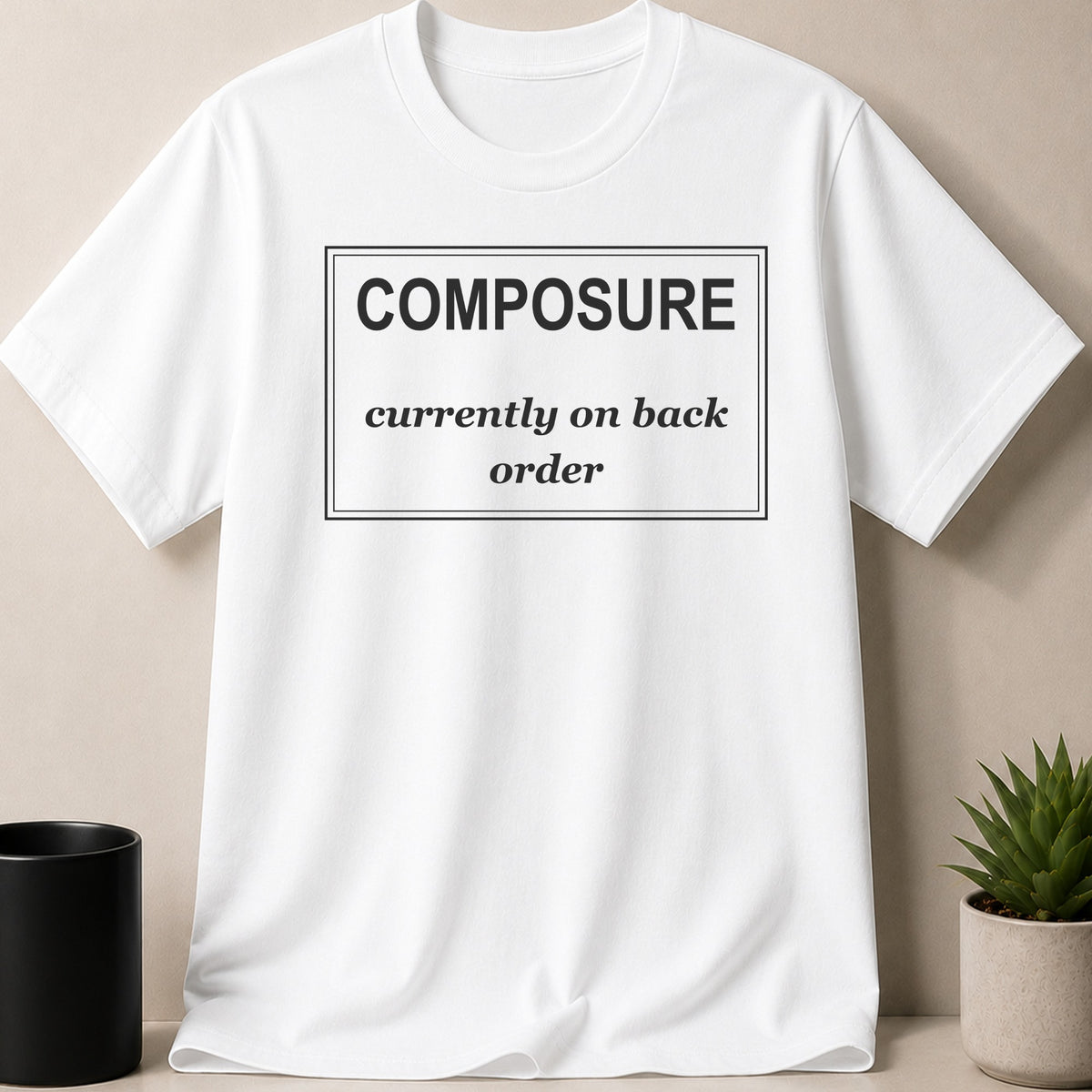 White t-shirt with black text "COMPOSURE currently on back order".