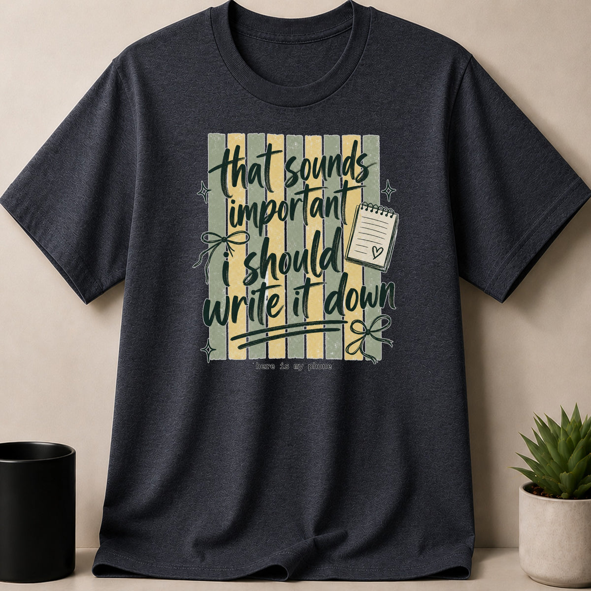 Dark grey t-shirt with text "that sounds important, I should write it down".