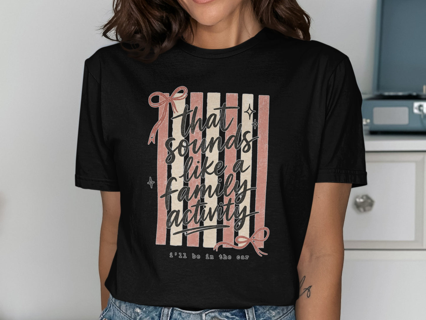 Black t-shirt with "that sounds like a family activity i'll be in the car" text.