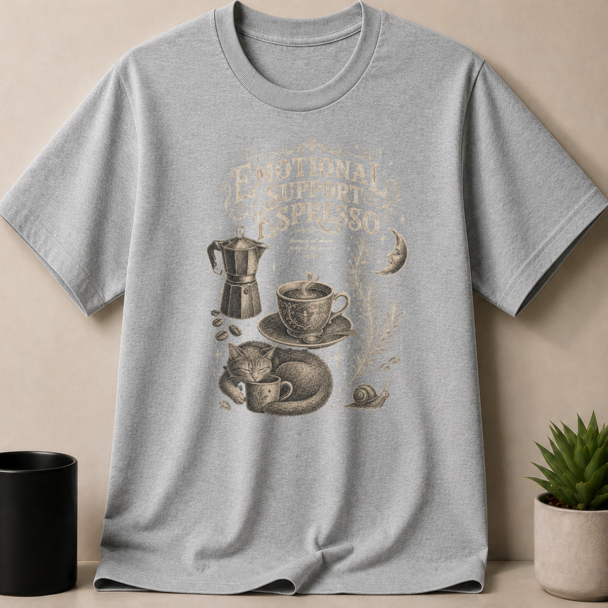Grey t-shirt with "Emotional Support Espresso" graphic featuring a cat, coffee, moon, and snail.