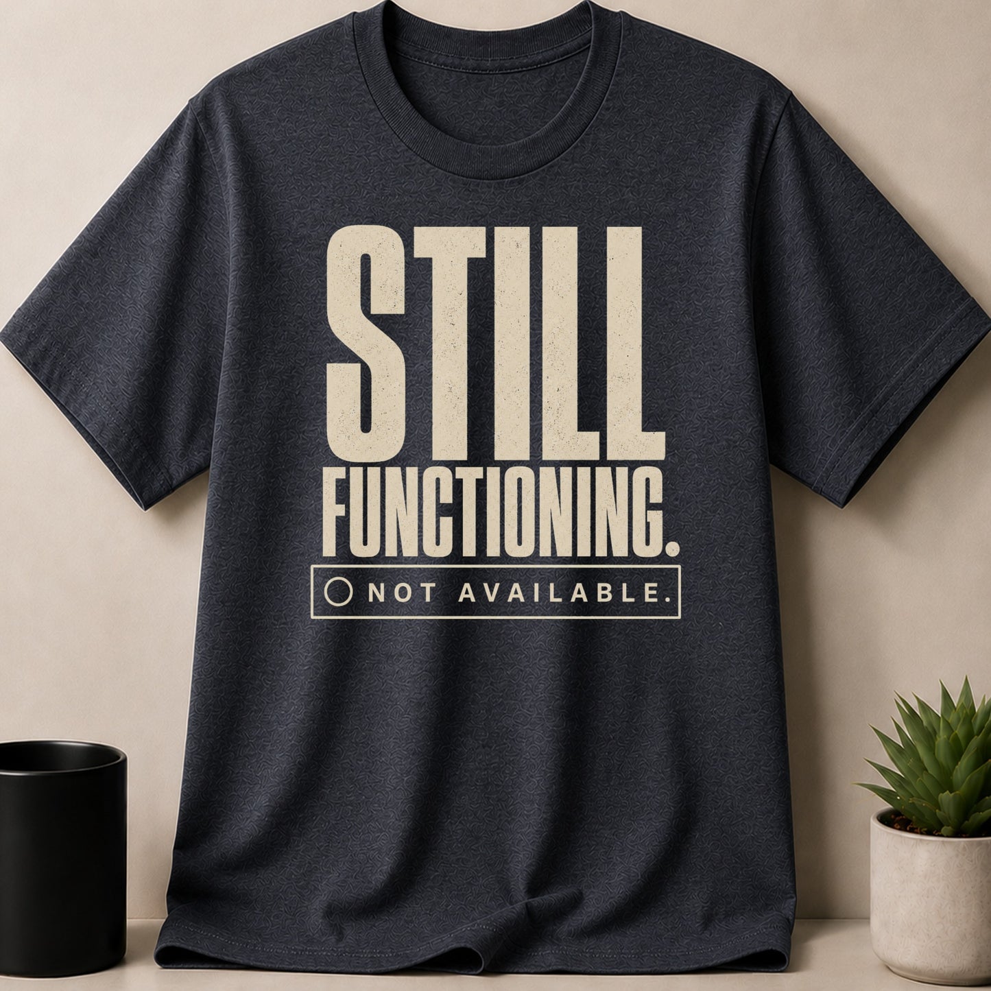 Dark t-shirt with "STILL FUNCTIONING. NOT AVAILABLE." text and a checkbox graphic.