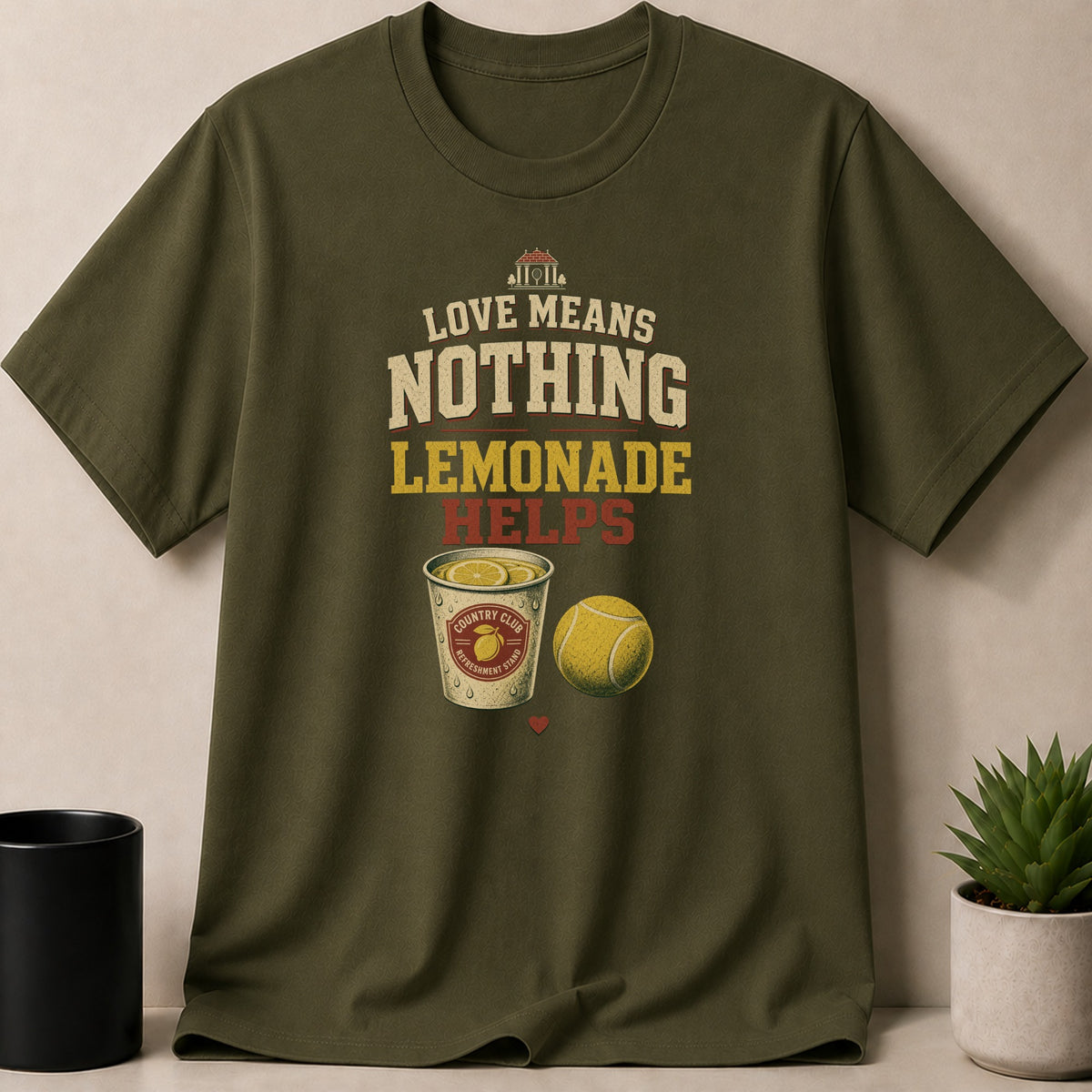 Olive green t-shirt with text: Love Means Nothing Lemonade Helps.