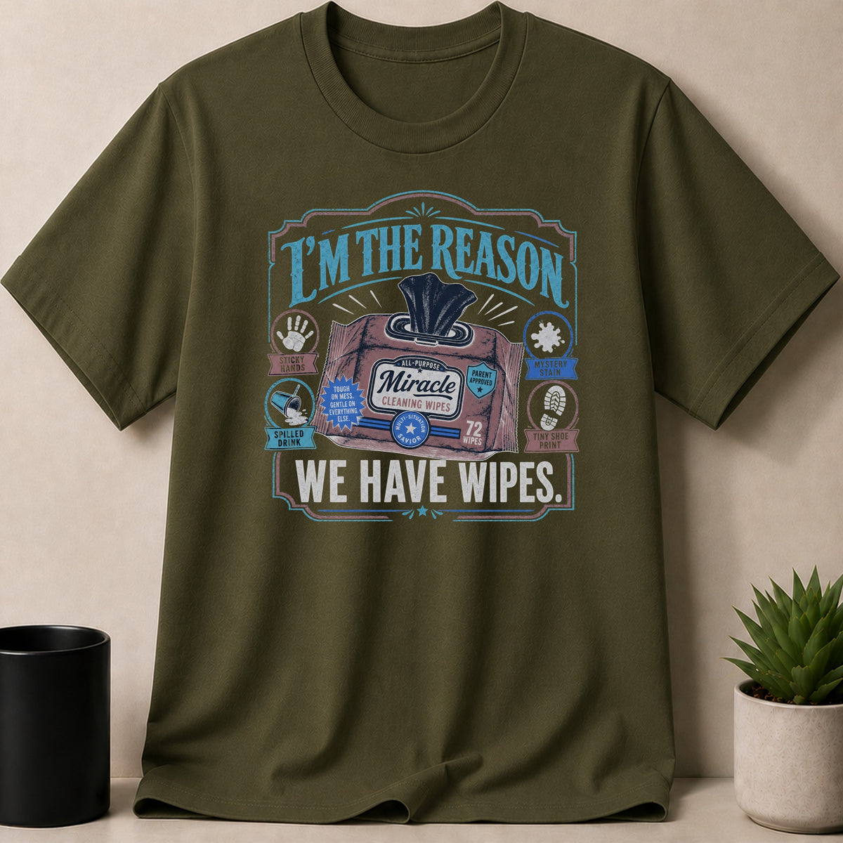 Olive green t-shirt with "I'm the Reason We Have Wipes" text and graphics.