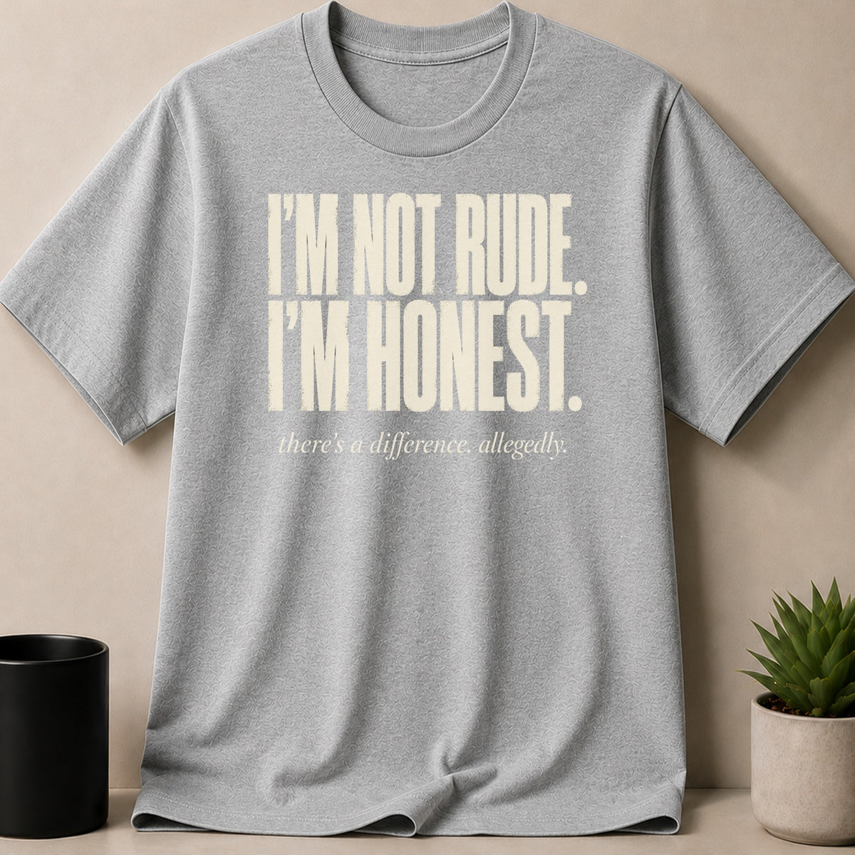 Grey t-shirt with "I'M NOT RUDE. I'M HONEST. there's a difference, allegedly." text.
