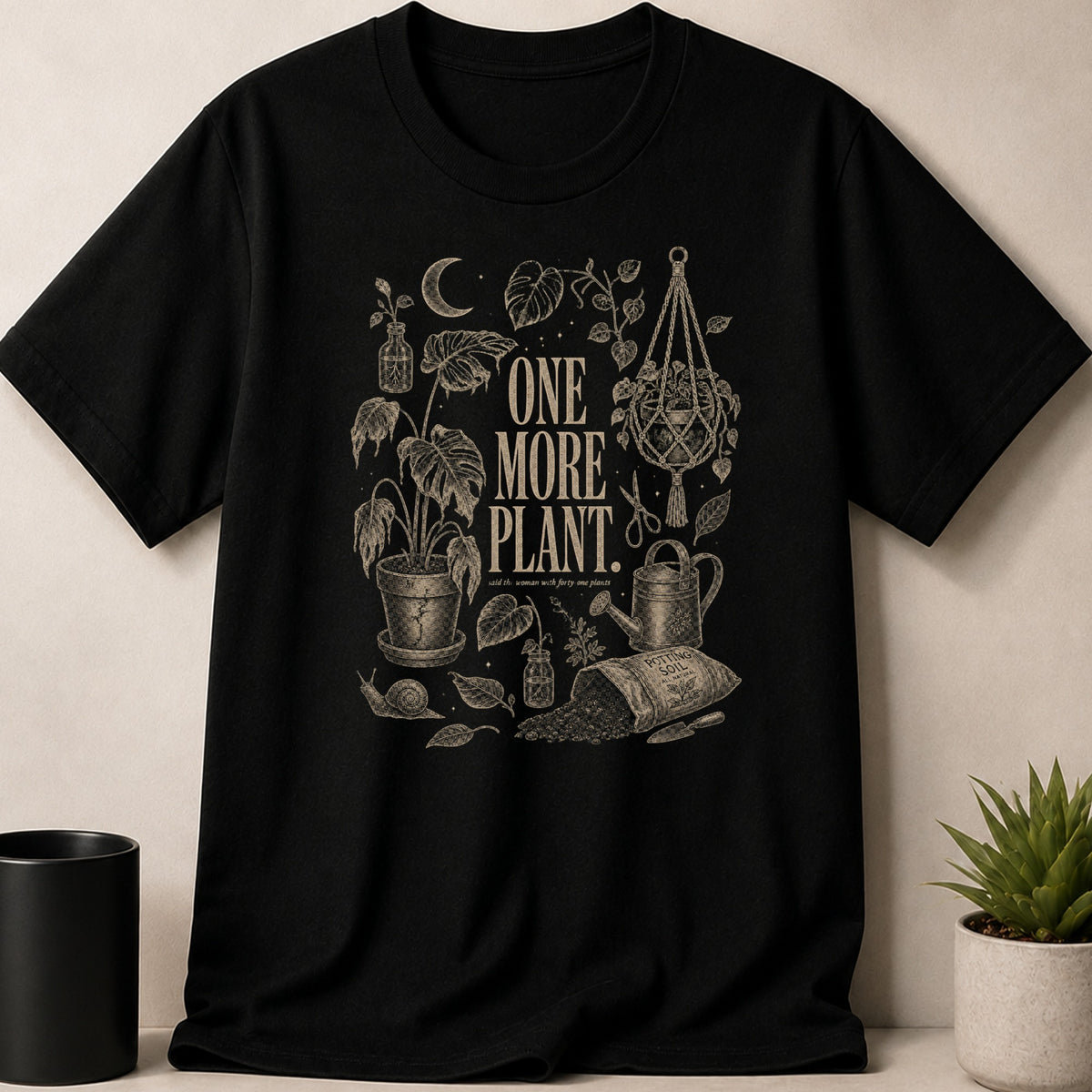 Black t-shirt with "One More Plant. Said the woman with forty one plants" text.