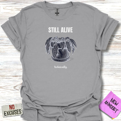 T-shirt with sketch of potted plant and text "STILL ALIVE technically."
