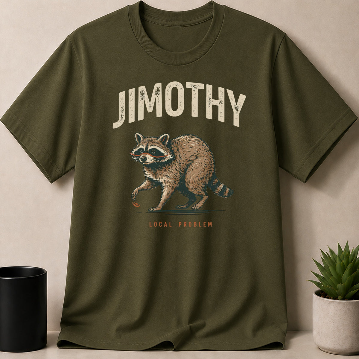 Olive green t-shirt with "JIMOTHY LOCAL PROBLEM" and a raccoon graphic.