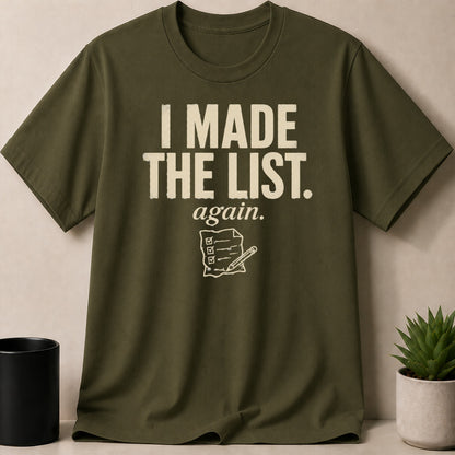 Olive green t-shirt with "I MADE THE LIST. again." and checklist graphic.
