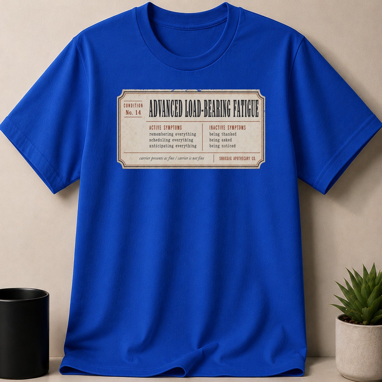 Blue t-shirt with "Advanced Load-Bearing Fatigue" text and symptoms list.