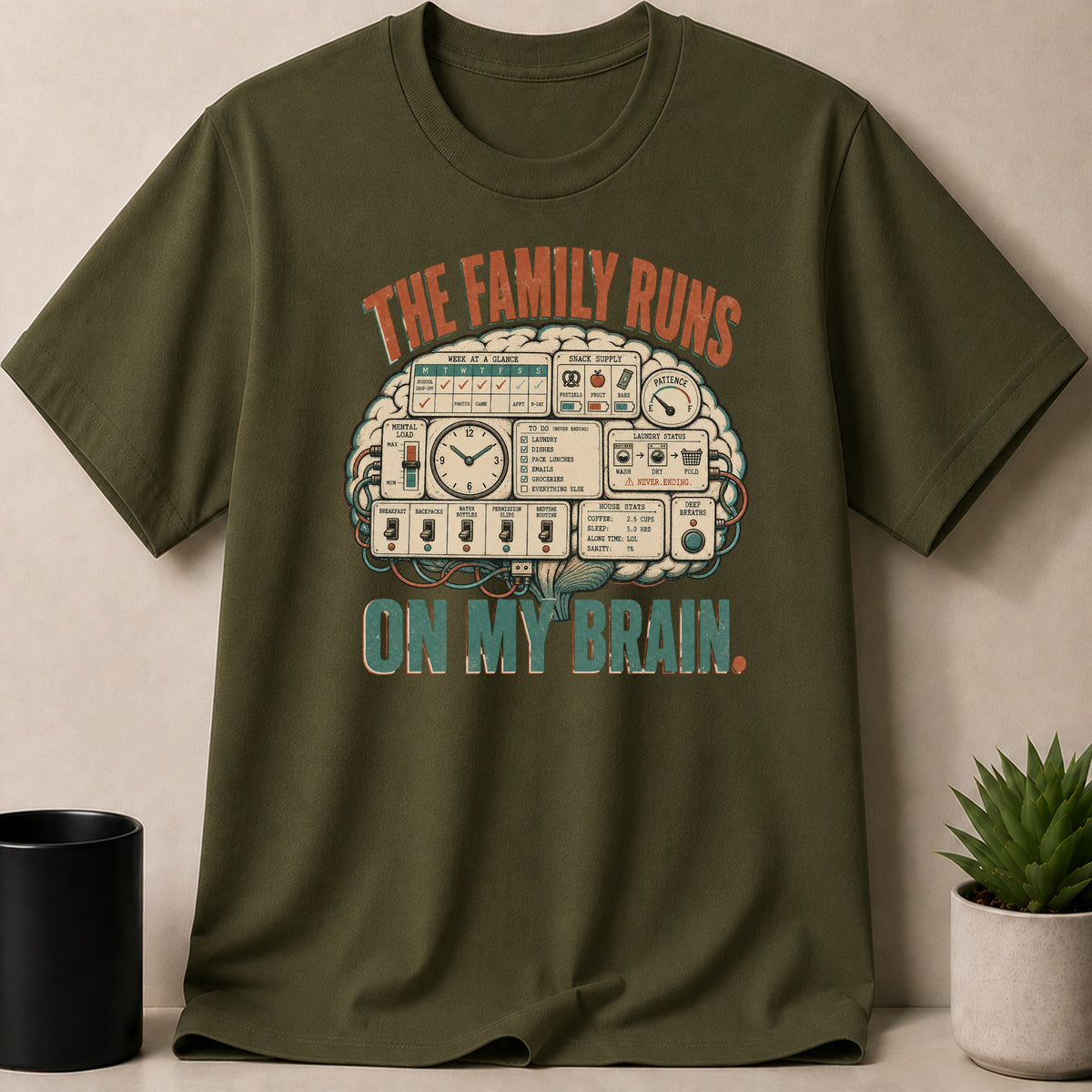 Green t-shirt with "The family runs ON MY BRAIN" graphic showing a brain as a control panel.