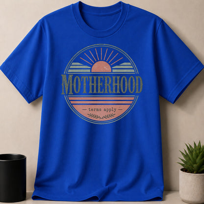 Blue t-shirt with "Motherhood - terms apply -" sun graphic.