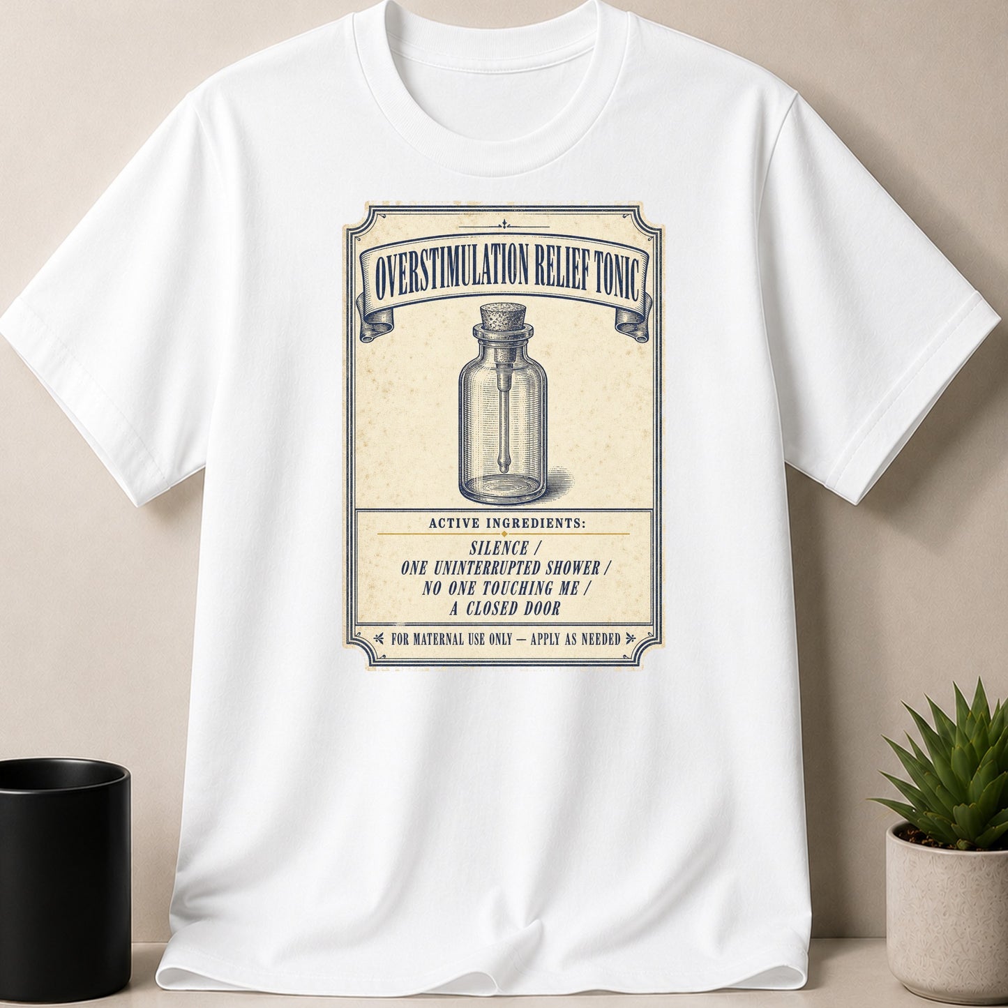 White t-shirt with a vintage label for "Overstimulation Relief Tonic" listing active ingredients.