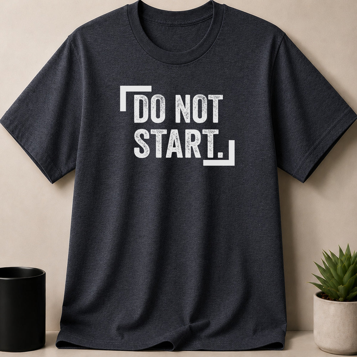 Dark gray t-shirt with white text that says "DO NOT START."
