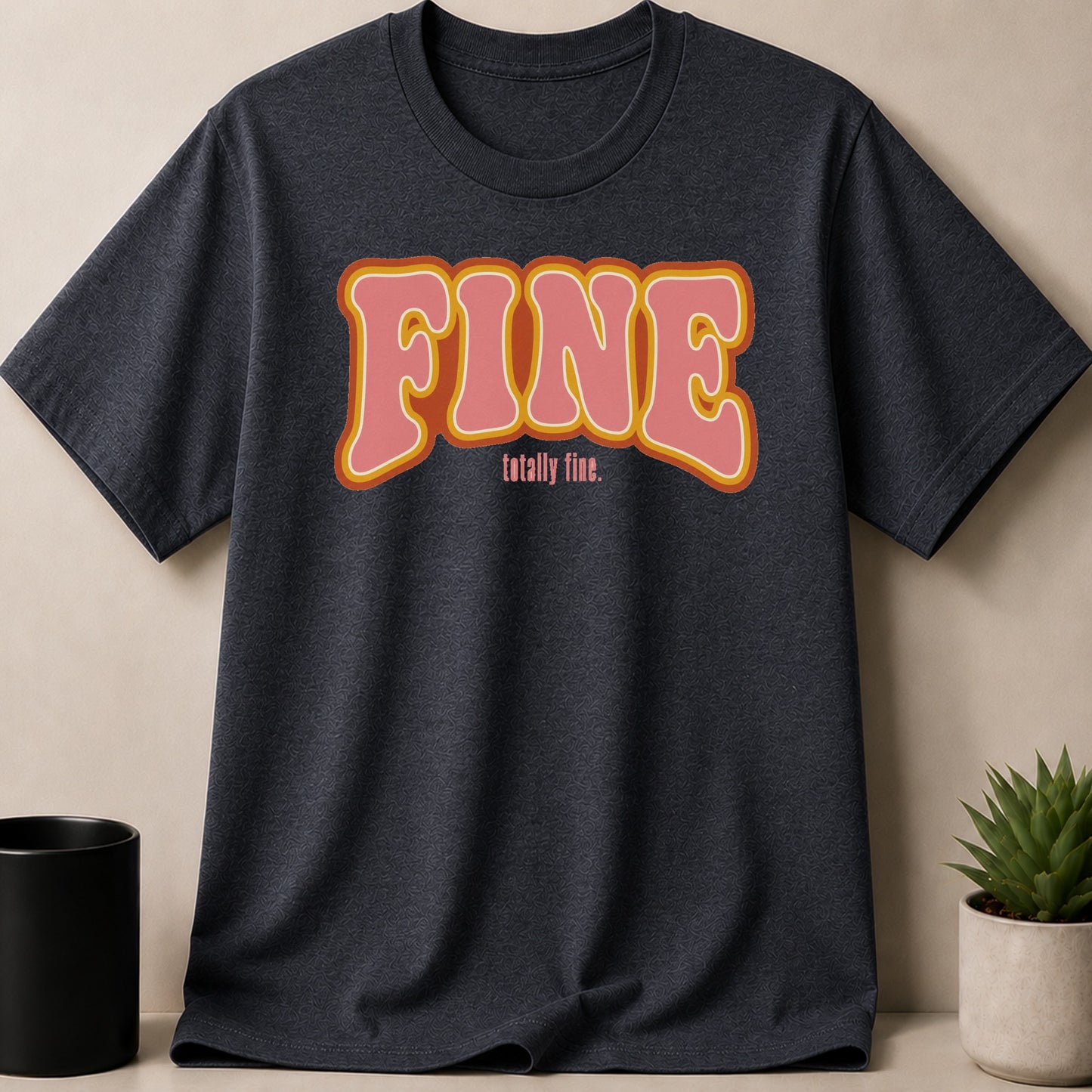 Dark grey t-shirt with "FINE totally fine." text in rounded, retro lettering.