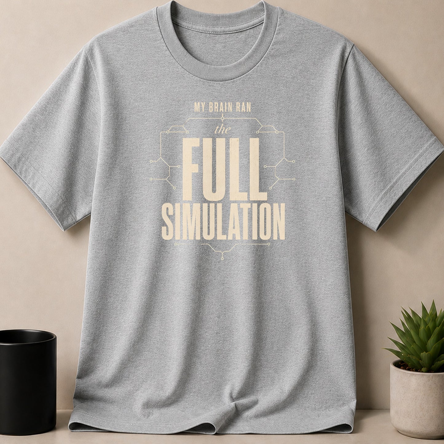 Grey t-shirt with "My brain ran the FULL SIMULATION" text in beige.