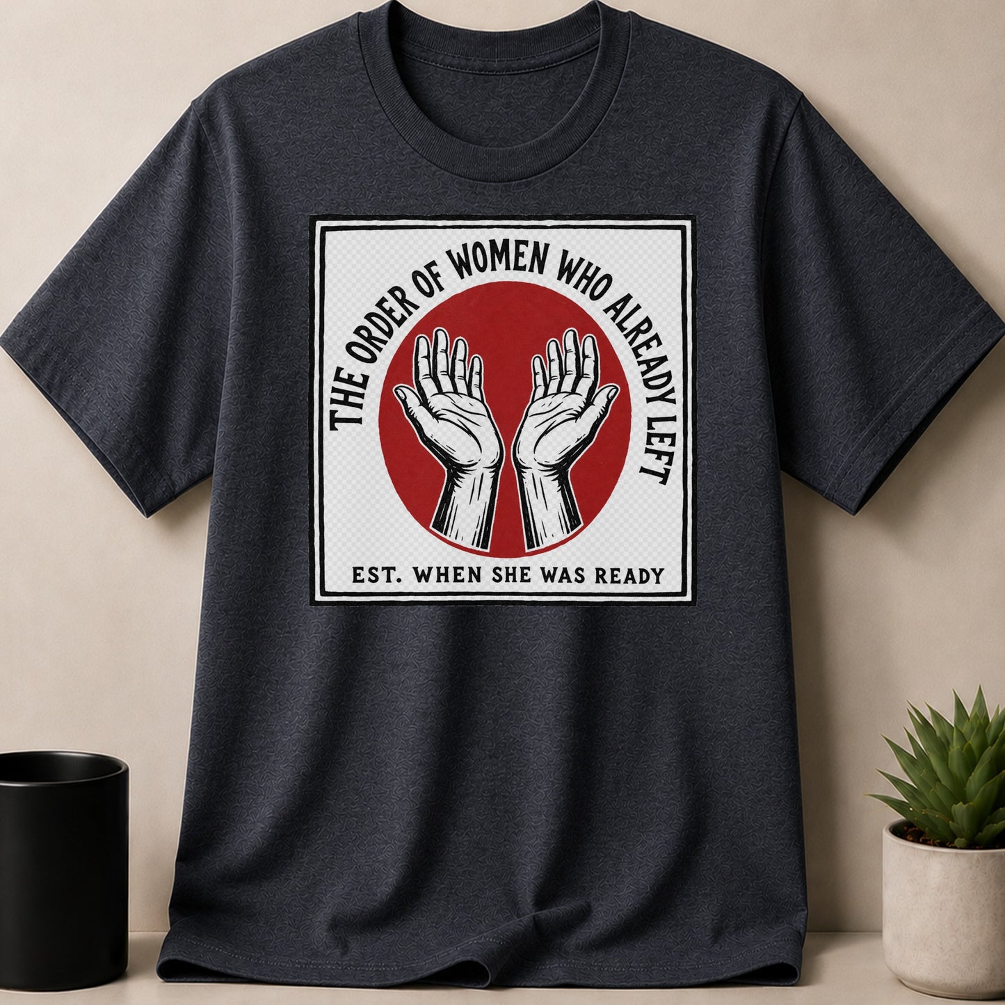 Dark t-shirt with white and black graphic that says "The Order of Women Who Already Left Est. When She Was Ready"