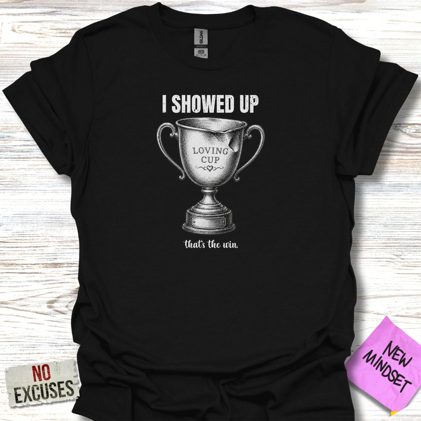 Black t-shirt with text "I SHOWED UP LOVING CUP that's the win".