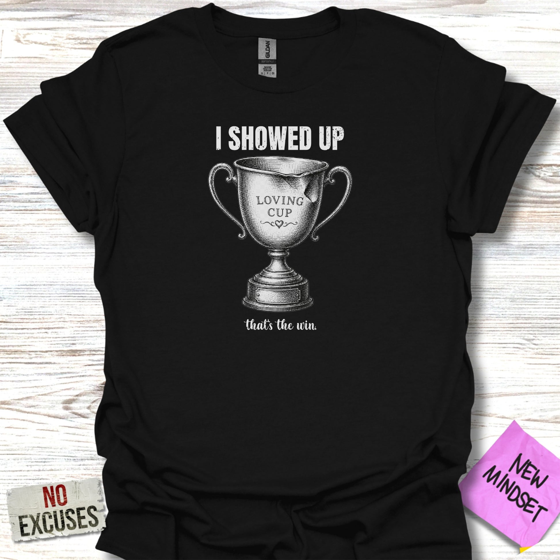 Black t-shirt with text "I SHOWED UP LOVING CUP that's the win".