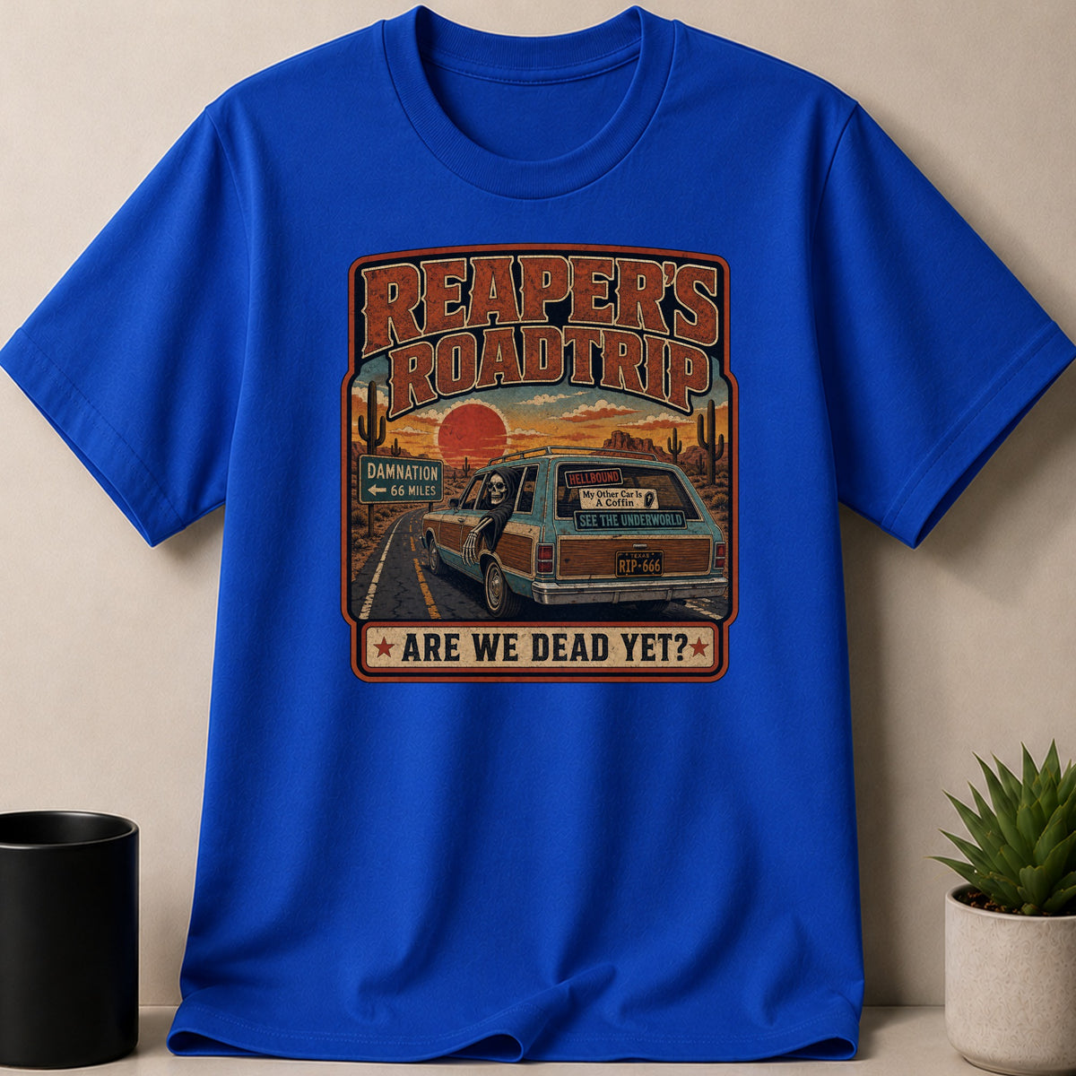 Royal t-shirt — Reaper's Roadtrip graphic with skull in station wagon, desert sunset, "Are We Dead Yet?"