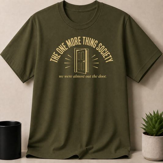 Olive t-shirt with gold text "THE ONE MORE THING SOCIETY" and a door.