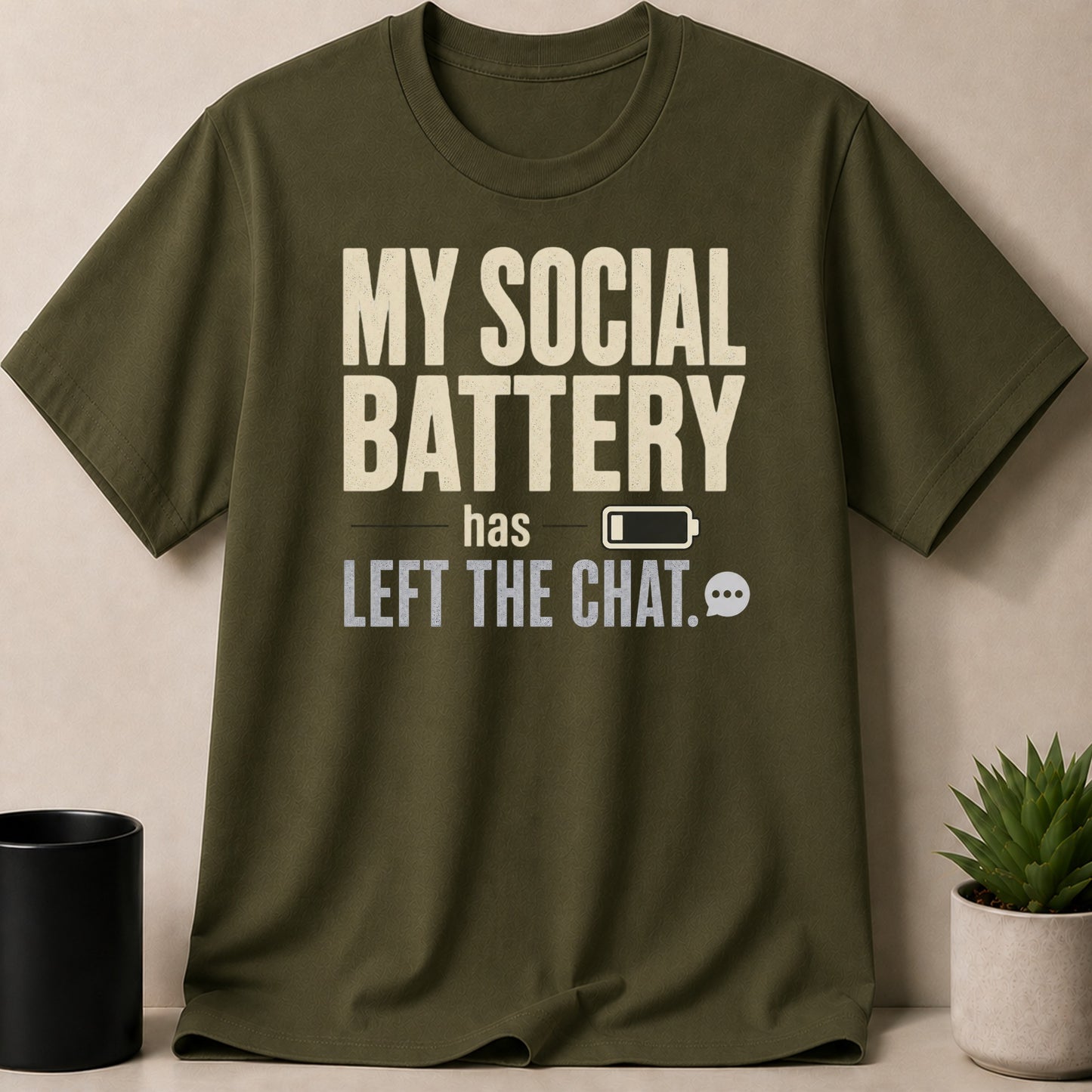 Olive green t-shirt with "MY SOCIAL BATTERY has LEFT THE CHAT." text.