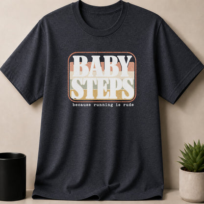 Dark t-shirt with "BABY STEPS" and "because running is rude" graphic.