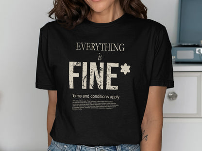Black t-shirt with "EVERYTHING is FINE*" and text.
