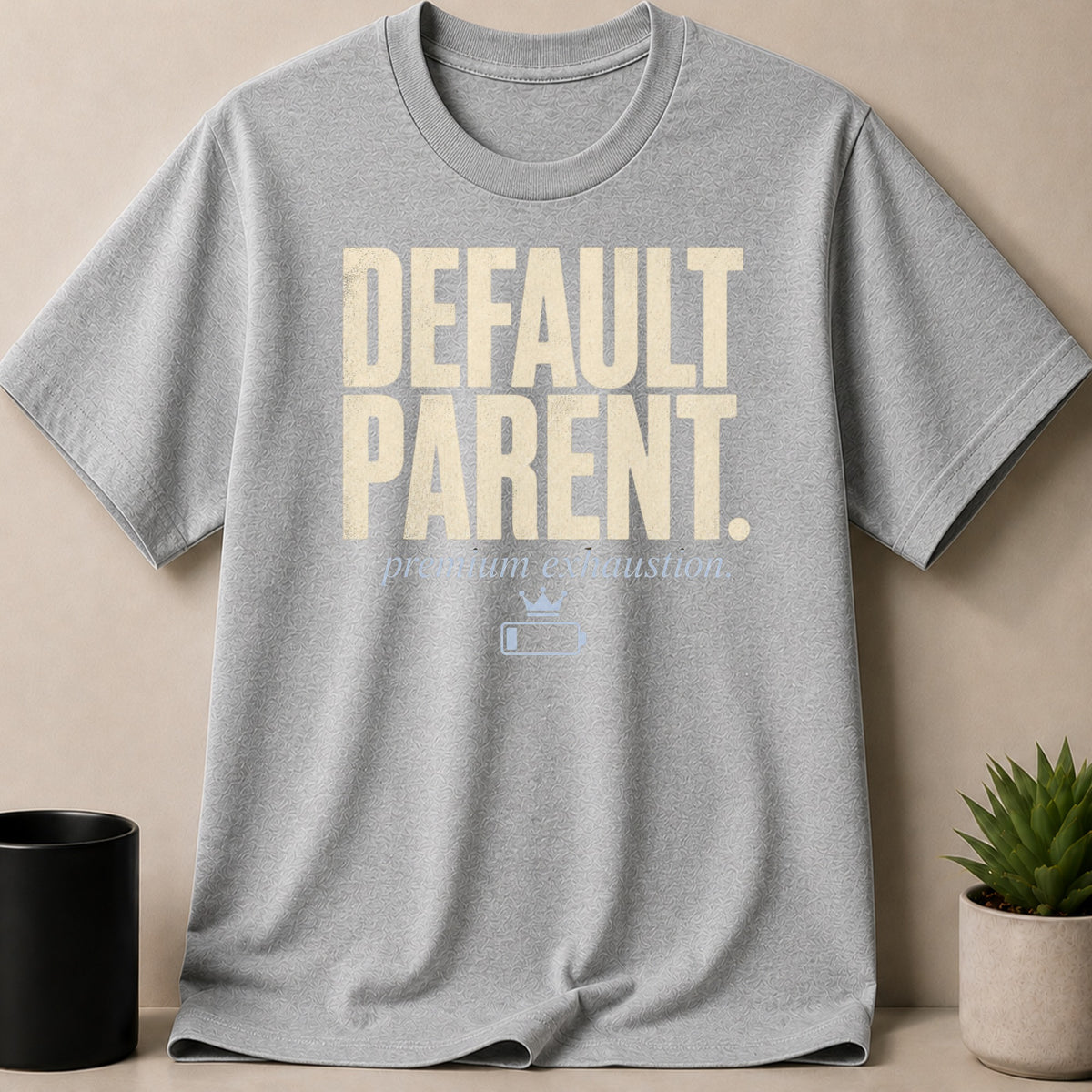 Grey t-shirt with "DEFAULT PARENT." and "premium exhaustion" text.