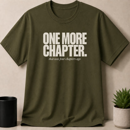 Olive green t-shirt with "ONE MORE CHAPTER. that was four chapters ago" text.