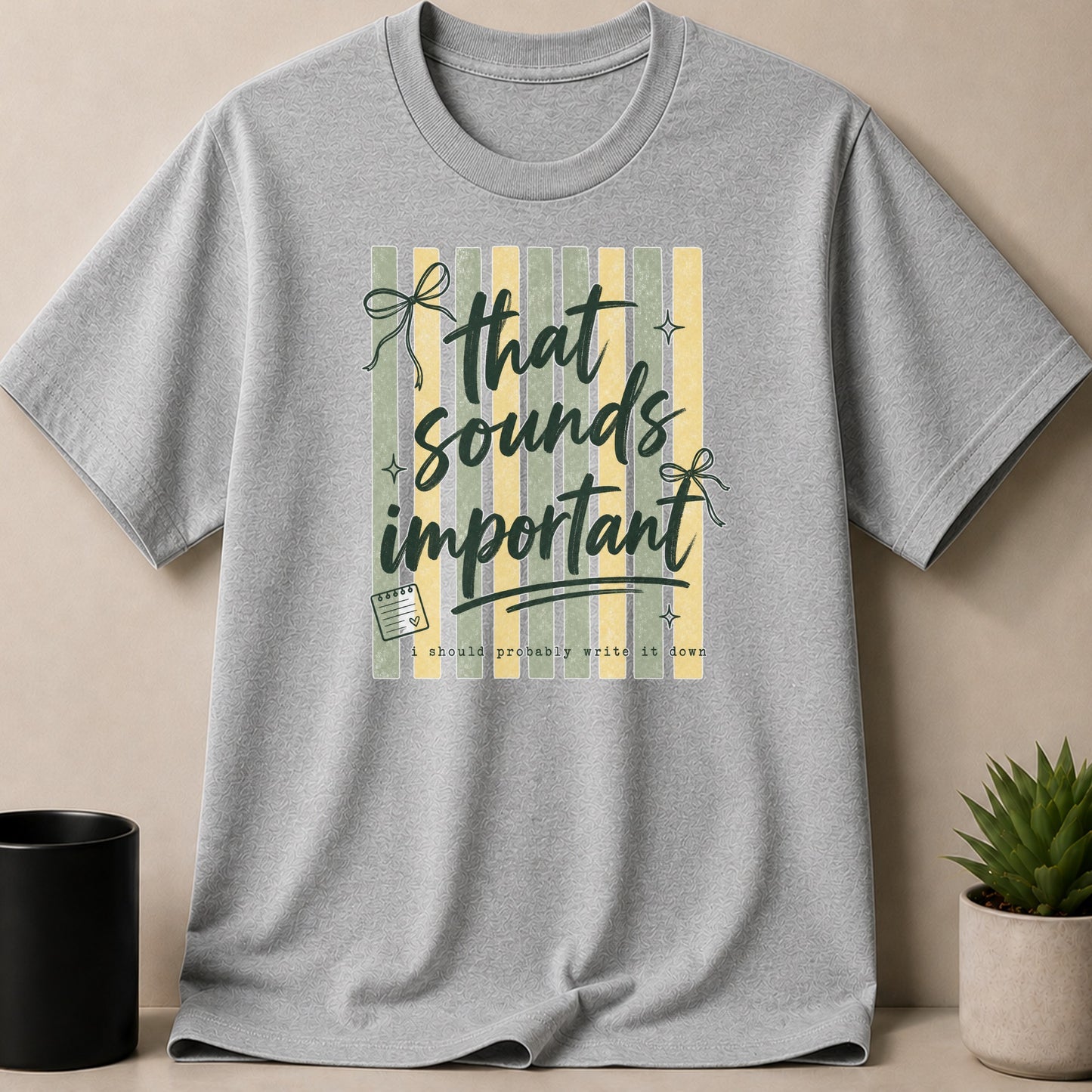 Grey t-shirt with text "that sounds important" and "i should probably write it down."