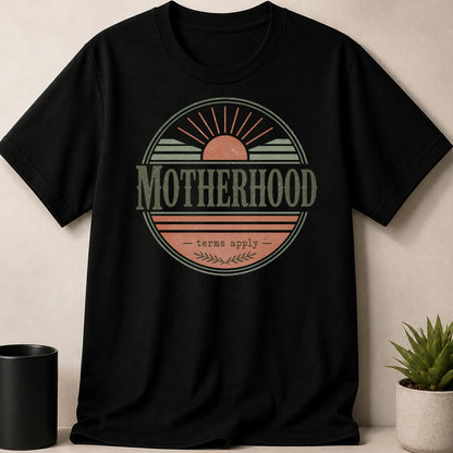 Black t-shirt with "Motherhood terms apply" distressed graphic and vintage sun design.