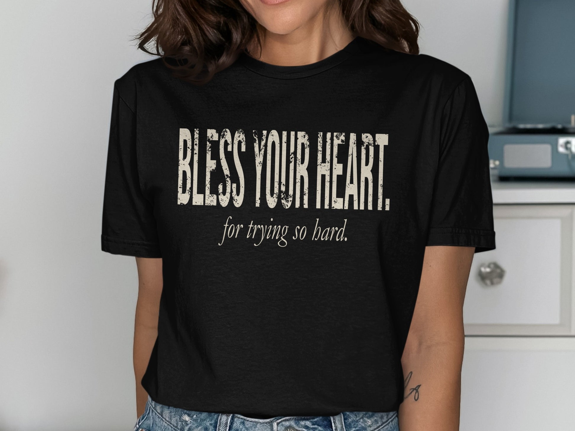 Black t-shirt with distressed text reading "BLESS YOUR HEART. for trying so hard."