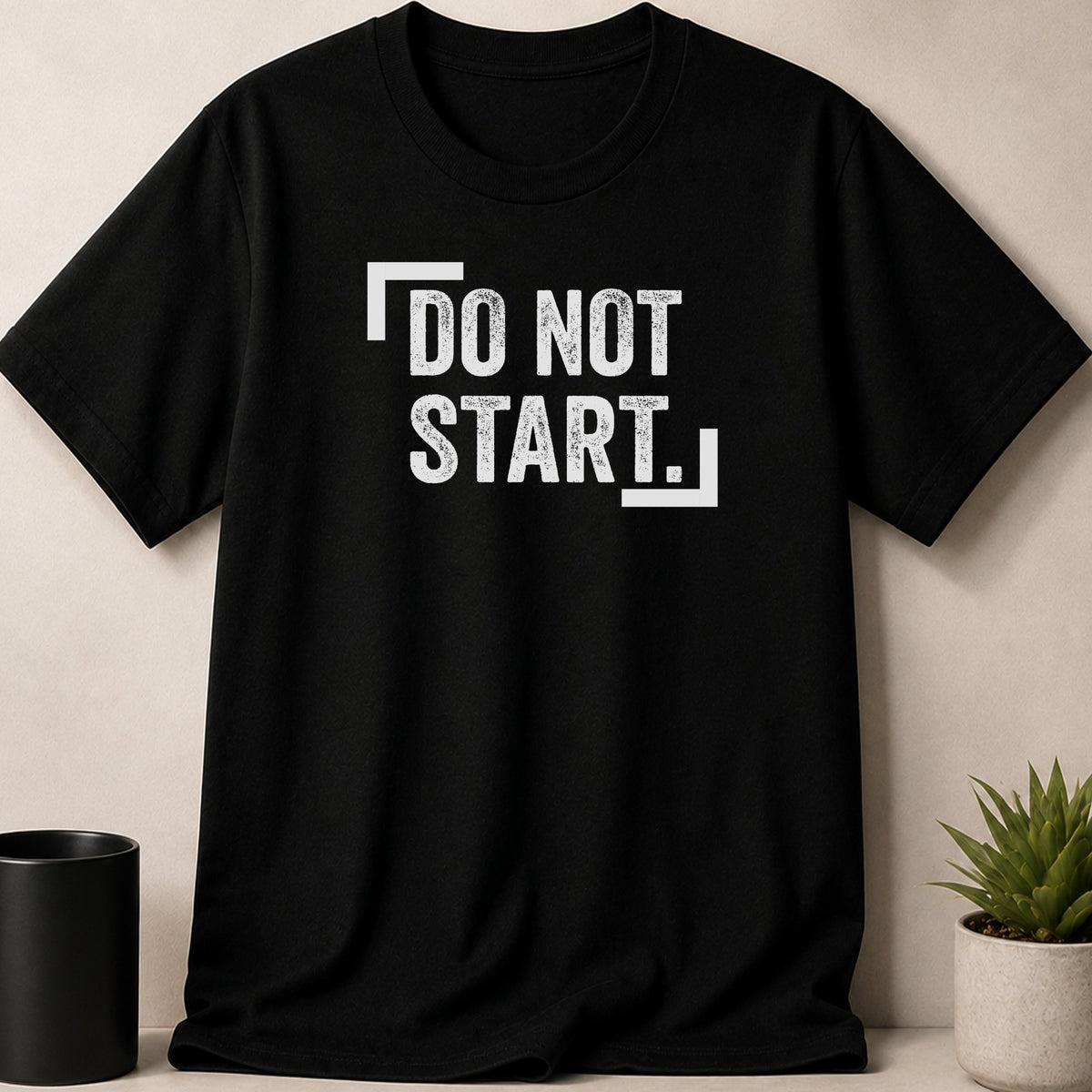 Black t-shirt with distressed white text "DO NOT START." and bracket graphics.