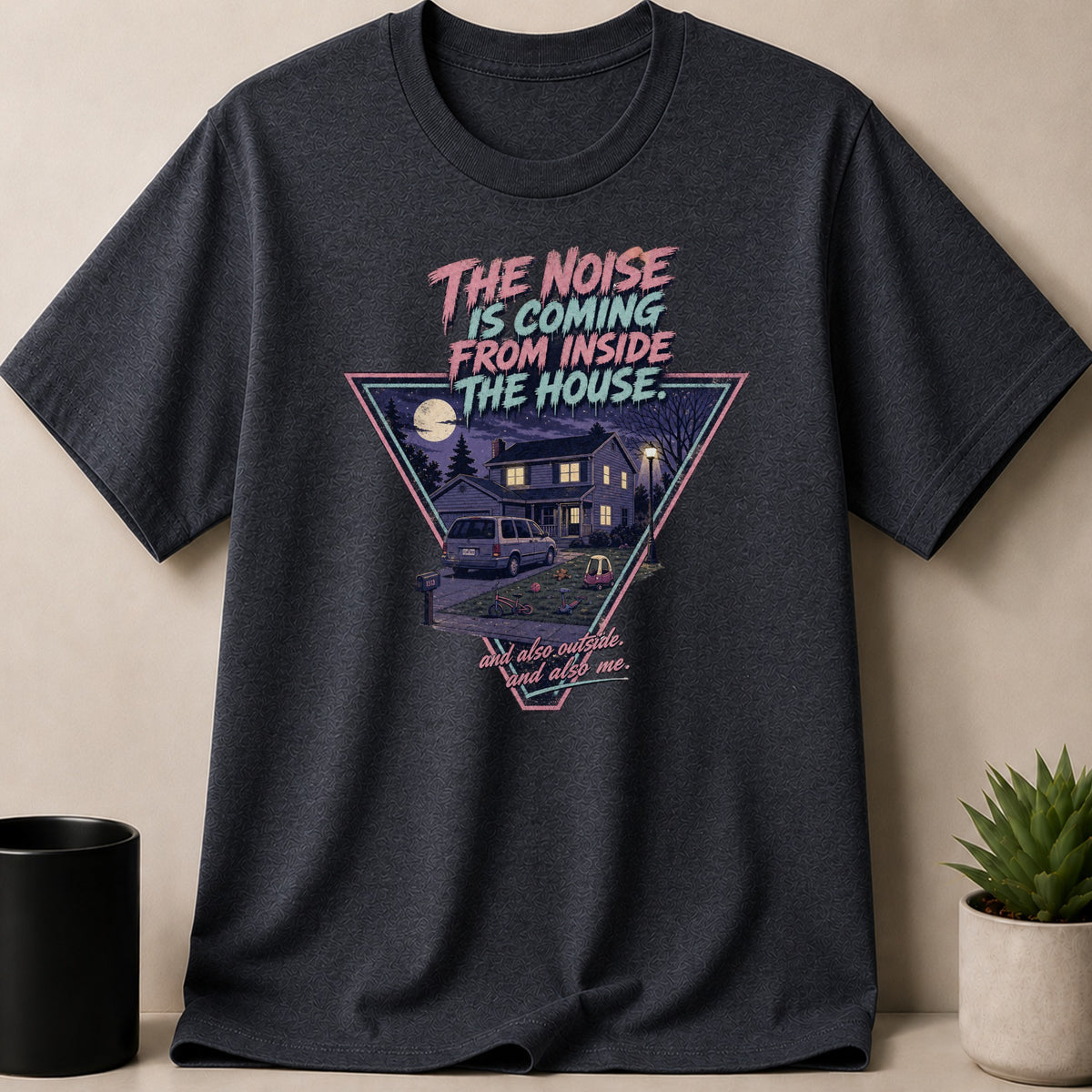 Dark t-shirt with graphic: "The Noise is Coming From Inside The House."