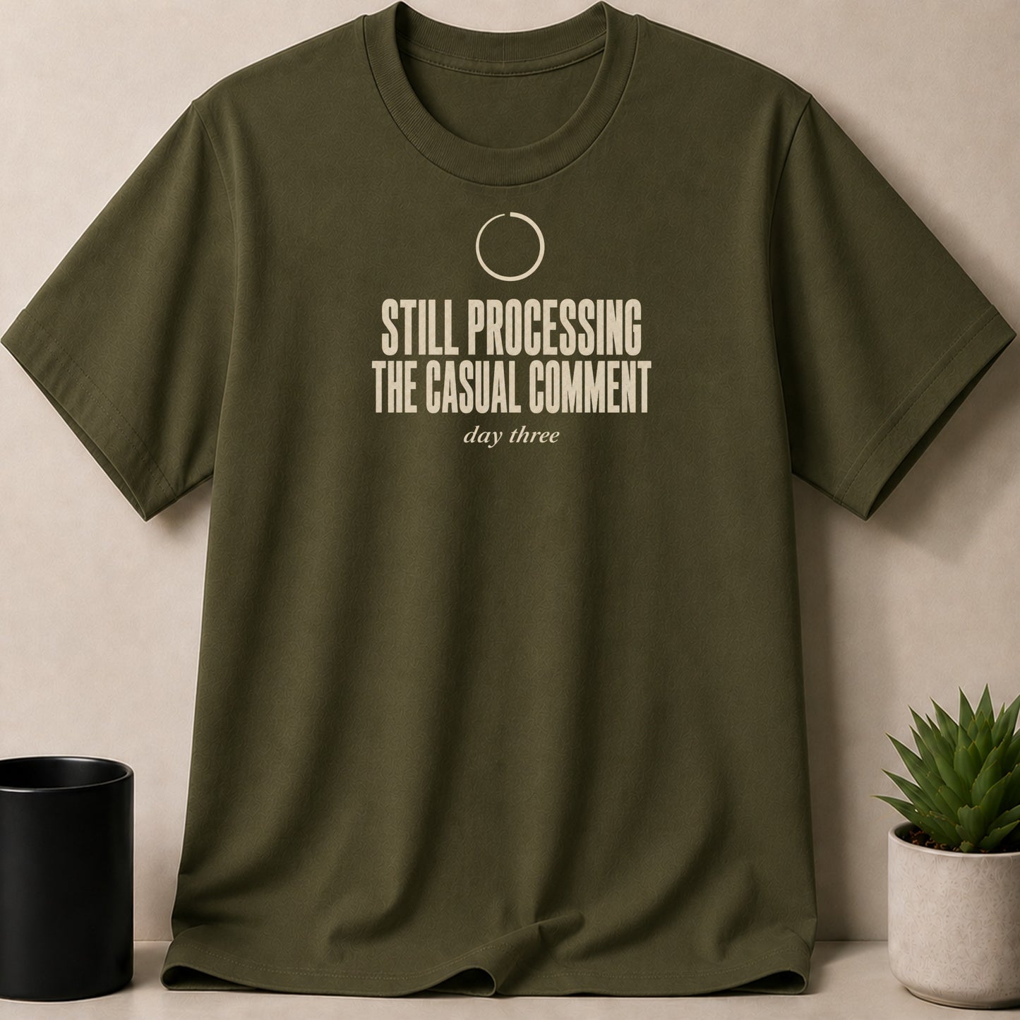 Green t-shirt with "STILL PROCESSING THE CASUAL COMMENT day three" text.