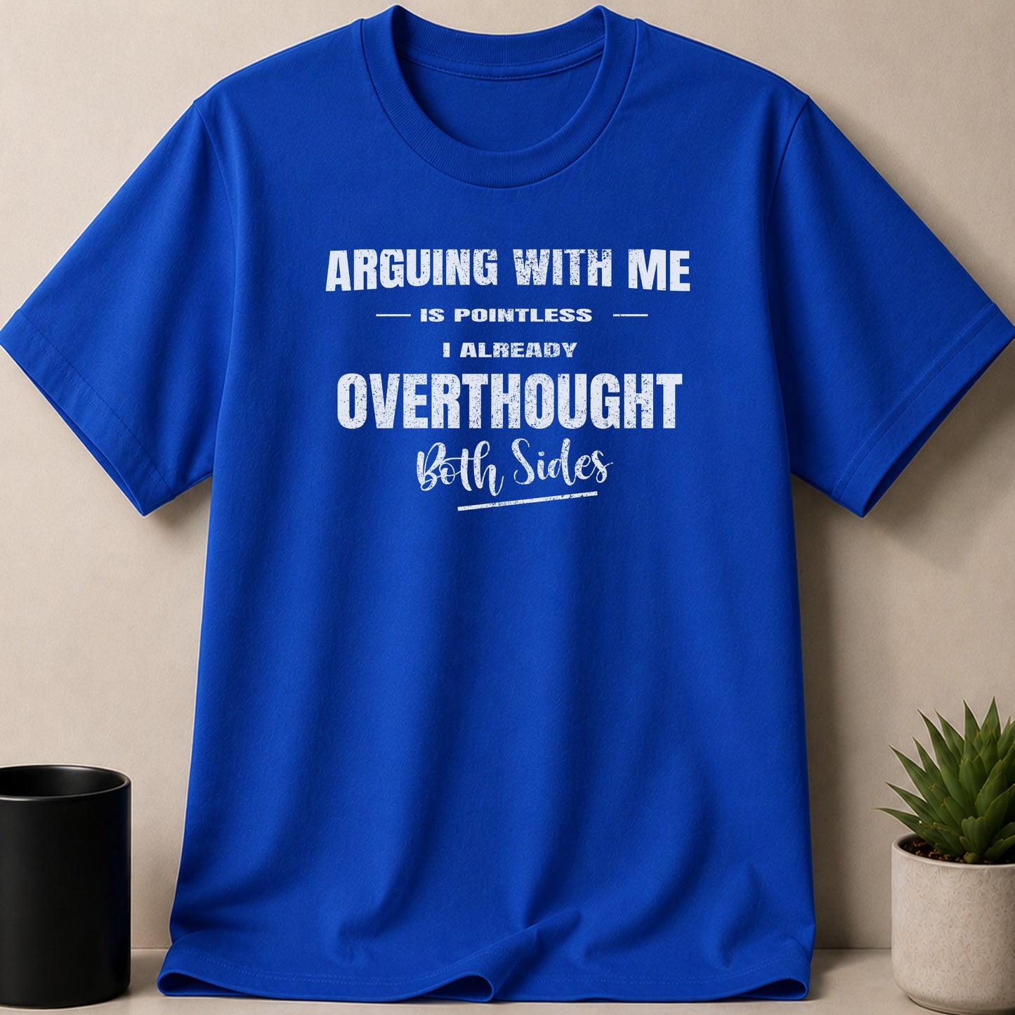Royal blue t-shirt with white text: "Arguing with me is pointless. I already overthought both sides."