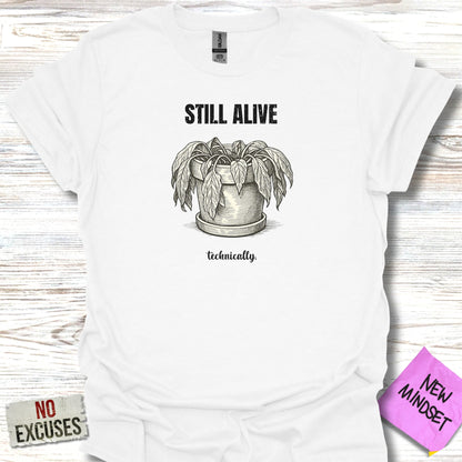 White t-shirt with wilted potted plant and text "STILL ALIVE technically."