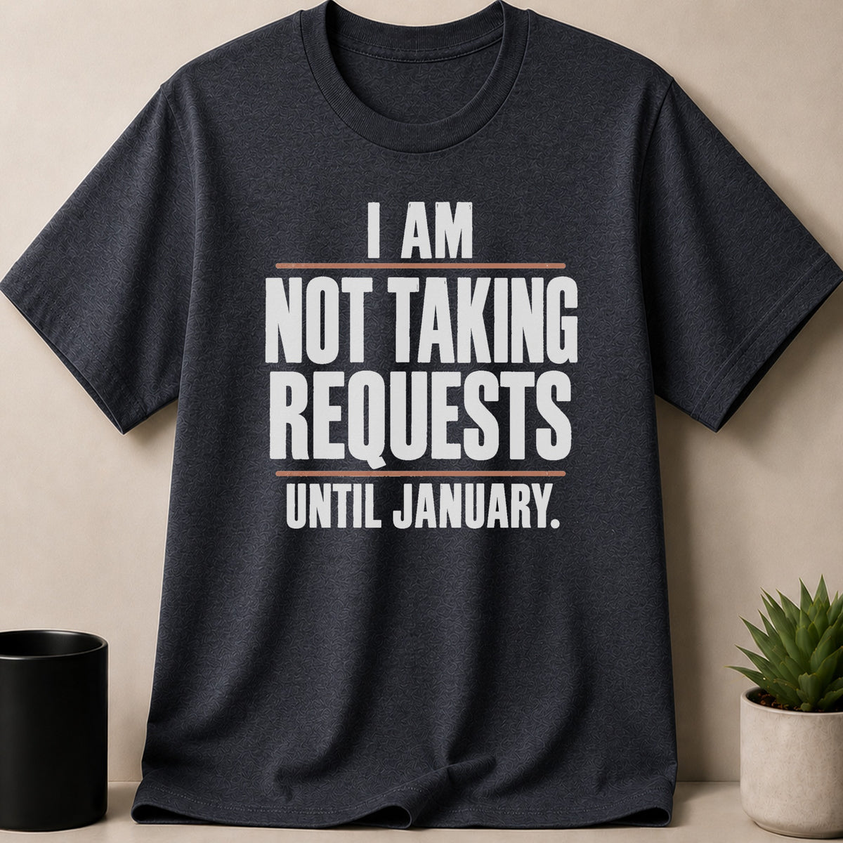 Dark grey crewneck t-shirt featuring white text that reads I AM NOT TAKING REQUESTS UNTIL JANUARY.
