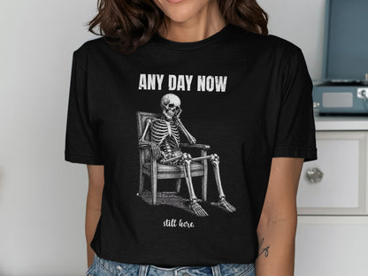 Skeleton sitting in chair with text "ANY DAY NOW" and "still here."