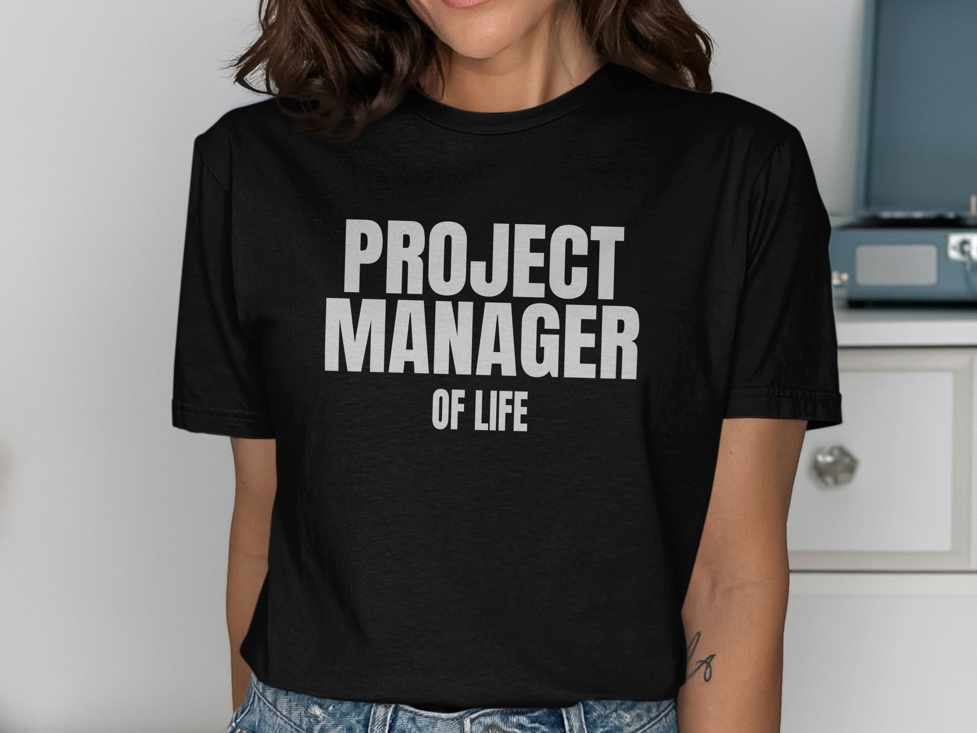 Black t-shirt with "PROJECT MANAGER OF LIFE" printed in white text.