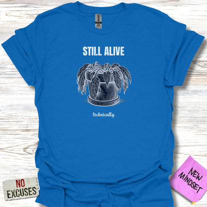 Blue t-shirt with an illustration of a potted plant and the text "STILL ALIVE technically."