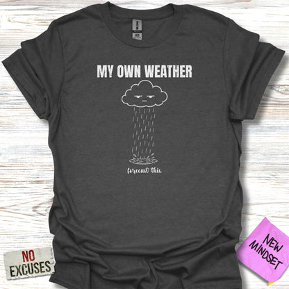 Dark t-shirt with "MY OWN WEATHER" and a frowning cloud with rain.