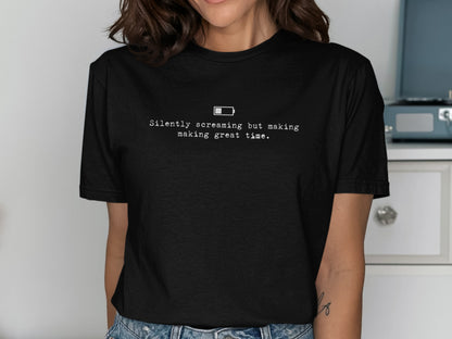 Black t-shirt with text "Silently screaming but making great time." and a low battery icon.