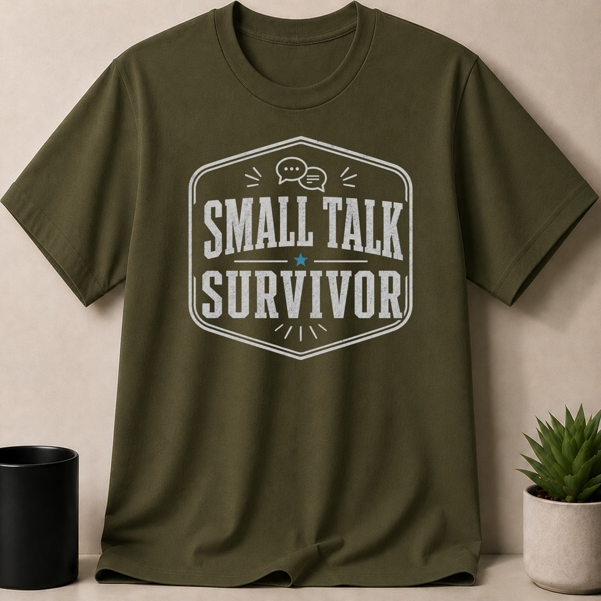Olive green t-shirt with "Small Talk Survivor" text and chat bubbles graphic.