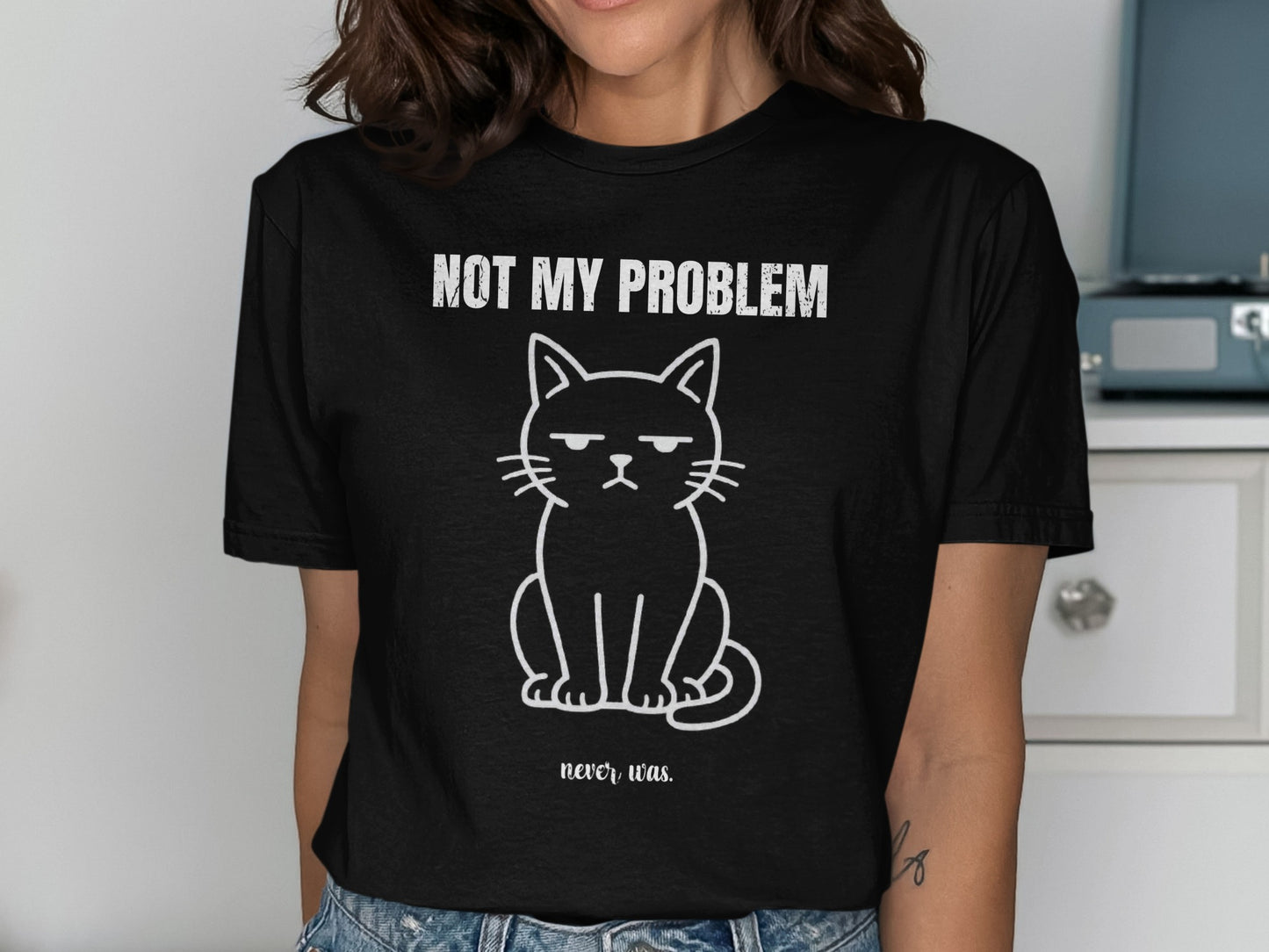 Black t-shirt with a grumpy cat graphic and "NOT MY PROBLEM never was." text.
