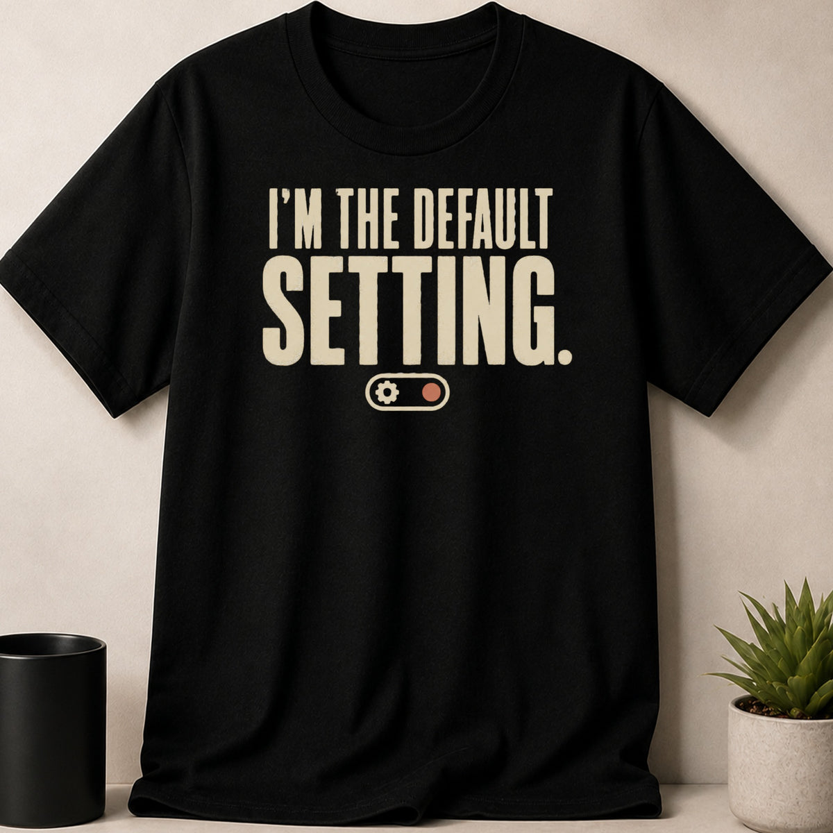 Black t-shirt with "I'M THE DEFAULT SETTING." text and a gear icon.